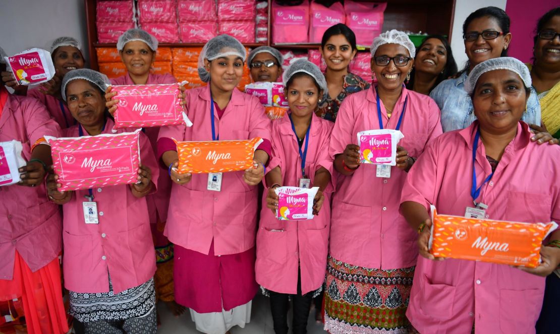 Women working for Myna Mahila Foundation in Mumbai show the sanitary pads they make and distribute. 