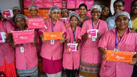 Women working for Myna Mahila Foundation in Mumbai show the sanitary pads they make and distribute.