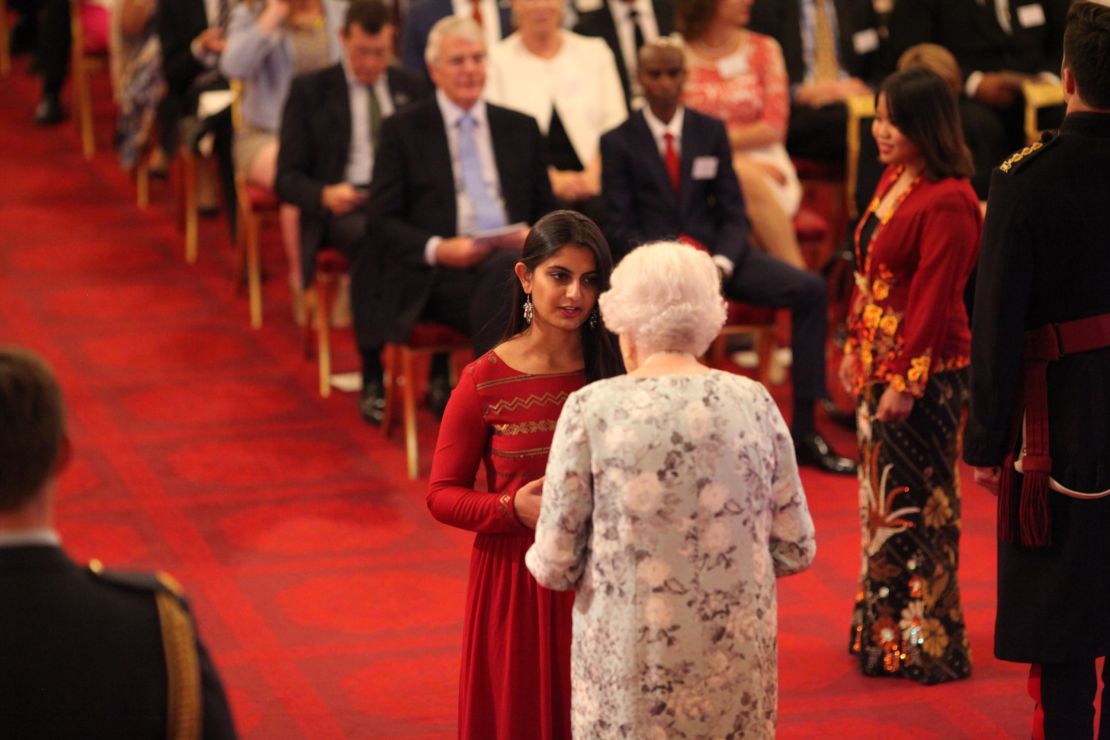 Suhani Jalota receiving a Queen's Young Leaders Award from Queen Elizabeth II at Buckingham Palace on June 29, 2017.
