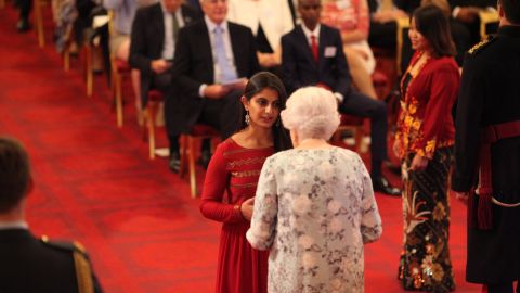 Suhani Jalota receiving a Queen's Young Leaders Award from Queen Elizabeth II at Buckingham Palace on June 29, 2017.
