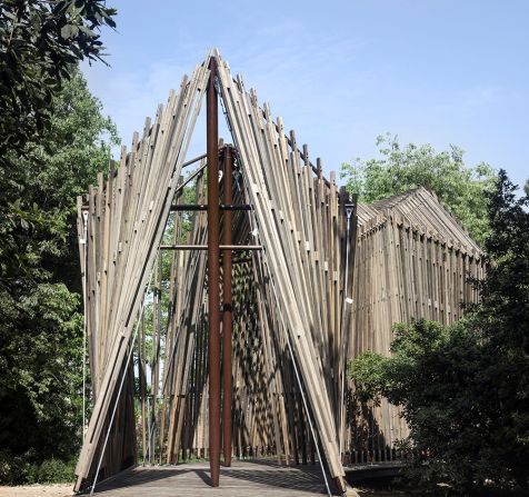 British architect Norman Foster chapel is meant to evoke an oasis. Flanked by two mature frees, it faces out onto the lagoon. Jasmine flowers wrapped around the posts of its canopy add to the feeling of serenity. 