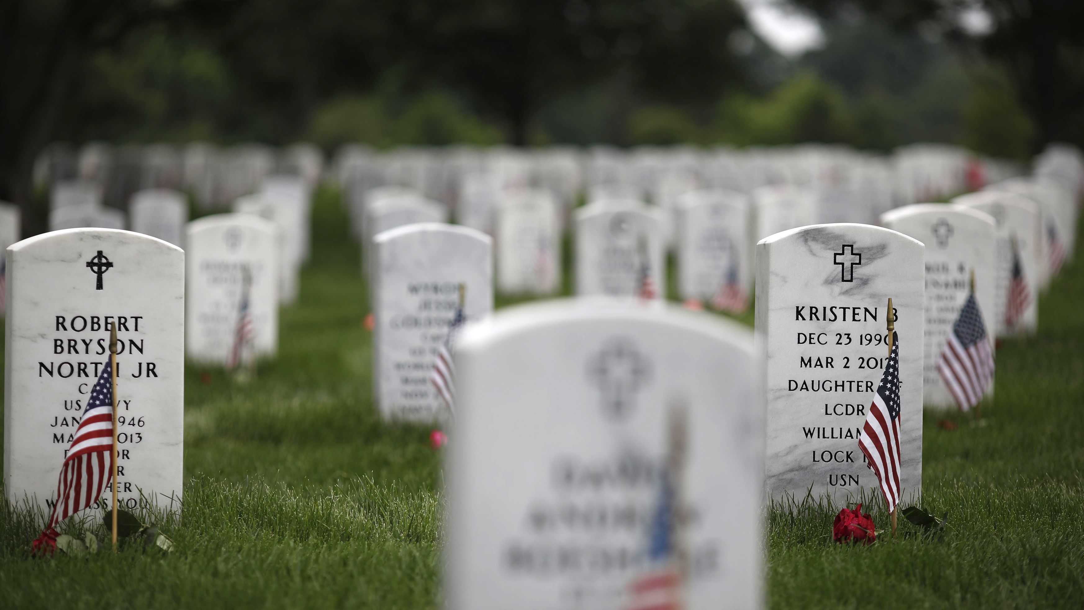  Headstones are adorned with flags at Arlington National Cemetery on Memorial Day, May 27, 2018 in Arlington, Virginia. Mourners from throughout the United States travel to Arlington to visit their loved ones on Memorial Day.