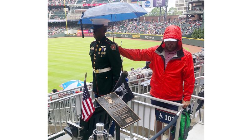 Wearing his umbrella hat, Blooper decided to take a dugout nap during the  Mets-Braves rain delay