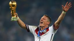 RIO DE JANEIRO, BRAZIL - JULY 13:  Bastian Schweinsteiger of Germany celebrates with the World Cup trophy after defeating Argentina 1-0 in extra time during the 2014 FIFA World Cup Brazil Final match between Germany and Argentina at Maracana on July 13, 2014 in Rio de Janeiro, Brazil.  (Photo by Clive Rose/Getty Images)