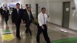 In this image made from video, Kim Yong Chol, in white, a former military intelligence chief who is now Kim Jong Un's top official on inter-Korean relations, walks upon arrival at Beijing airport in Beijing Tuesday, May 29, 2018. He was at North Korean leader Kim Jong Un's side at the table in last weekend's North-South summit, and had been a prominent senior official in other important talks. It was not possible to confirm the reason for his visit to Beijing, or if he would be traveling on to another destination. (AP Photo)