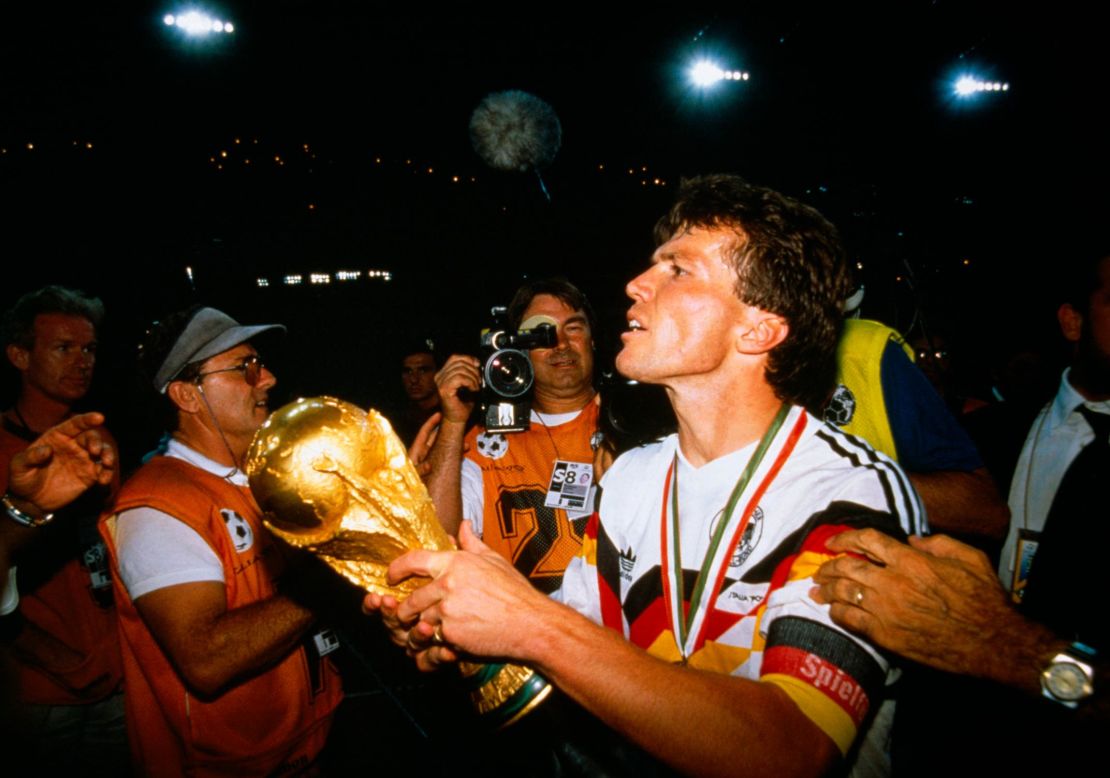 Germany captain Lothar Matthäus holds aloft the World Cup trohpy after defeating Argentina 1-0 in 1990.