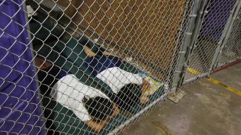 Two female detainees sleep in a holding cell at a US Customs and Border Protection facility in Nogales, Arizona, in 2014.