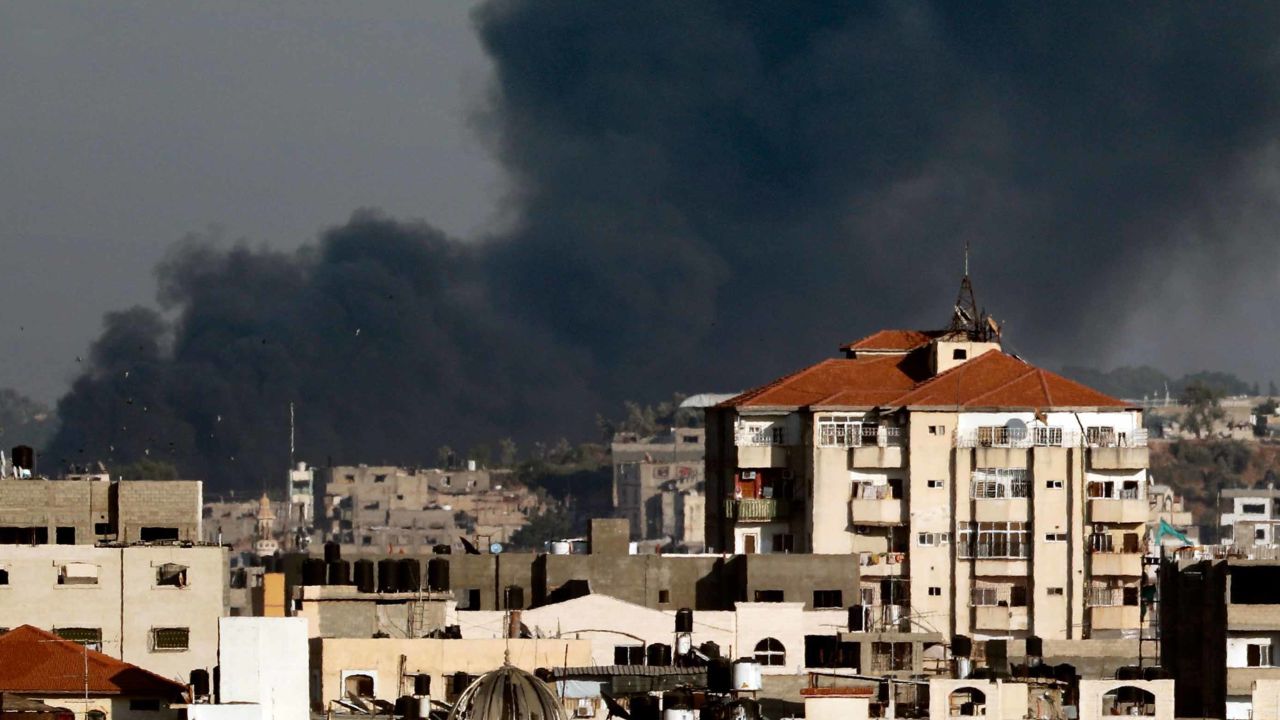 A picture taken from Gaza City on May 29, 2018 shows smoke billowing in the background following an Israeli air strike on the Palestinian coastal enclave. - Israel's military struck more than 30 "military targets" in the Gaza Strip today in response to a barrage of rocket and mortar fire from the Palestinian enclave, the army said. (Photo by THOMAS COEX / AFP)        (Photo credit should read THOMAS COEX/AFP/Getty Images)