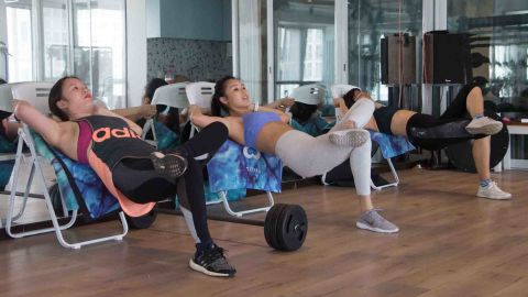 Young Chinese women are using resistance bonds to build muscles in legs.