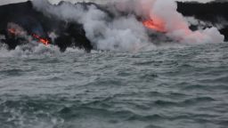 Lava continues to flow into the ocean off of the cost of Hawaii near Pahoa.The lava can be seen dripping into the ocean as waves crash against the seawall.