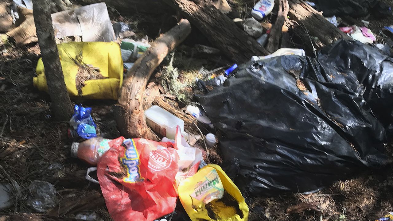 This photo provided by the US Attorney's Office shows trash found at an illegal marijuana site near Hayfork, California.