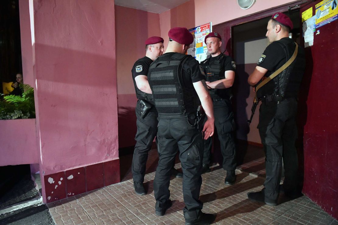 Police guard the building where Arkady Babchenko was shot dead, in Kiev, on Tuesday.