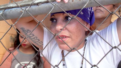 Roxana, photographed wearing a blue bandana, said she has retired from gang culture.