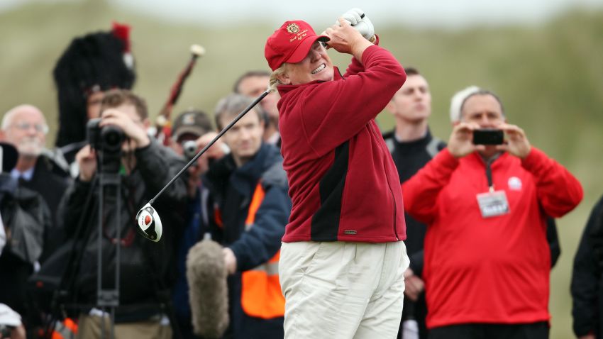 ABERDEEN, SCOTLAND - JULY 10:  Donald Trump opens The Trump International Golf Links Course in Balmedie by hitting the first ball down the first fairway on July 10, 2012 in Balmedie, Scotland. The controversial £100m course opens to the public on Sunday July 15. Further plans to build hotels and homes on the site have been put on hold until a decision has been made on the building of an offshore windfarm nearby. (Photo by Ian MacNicol/Getty Images)