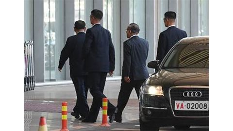 Top North Korean official Kim Yong Chol (far left) arrives at Beijing International Airport on Wednesday afternoon, local time.