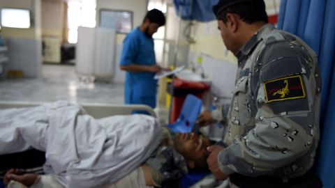 A wounded Afghan policeman receives treatment at a hospital after the attack on the Interior Ministry in Kabul.