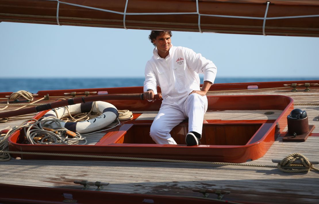 Rafael Nadal at the helm of a classic yacht during the 2014 Monte Carlo Masters.