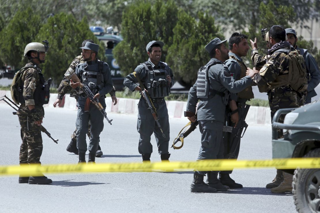 Afghan security personnel guard  the site of the attack.