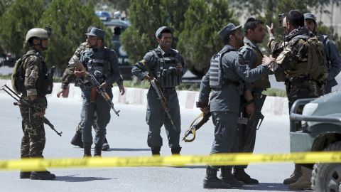Afghan security personnel guard the site of the attack.
