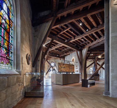 During the restoration, numerous artifacts were found, including stained glass shards that are now proudly displayed on the bridge connecting the attic to the new tower.
