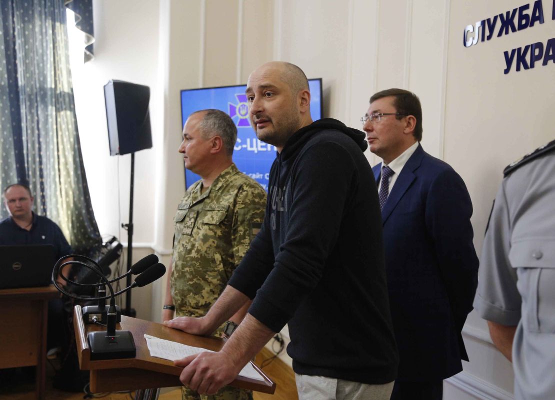 Arkady Babchenko, center, speaks to the media as Vasily Gritsak, head of the Ukrainian Security Service, left, and Ukrainian Prosecutor General Yuriy Lutsenko attend a news conference Wednesday.