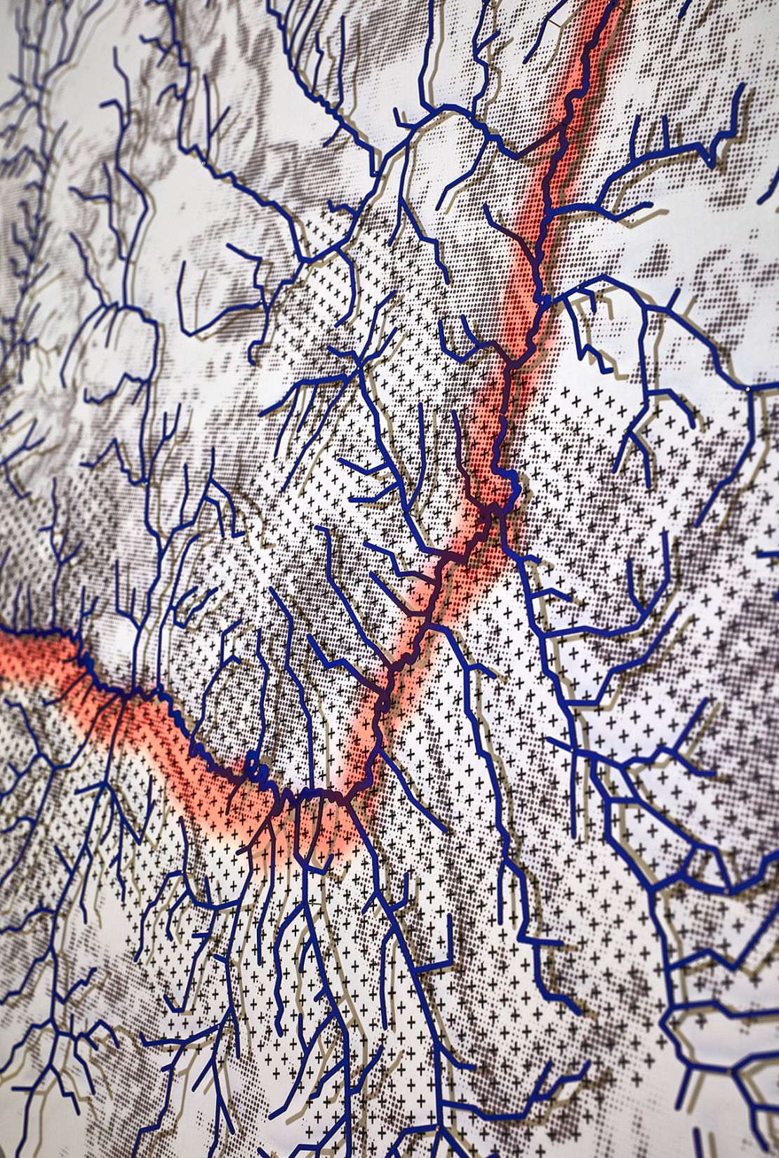 A close-up of Estudio Teddy Cruz + Fonna Forman's map showing how waterways are bifurcated by infrastructure associated with the US-Mexico border. 