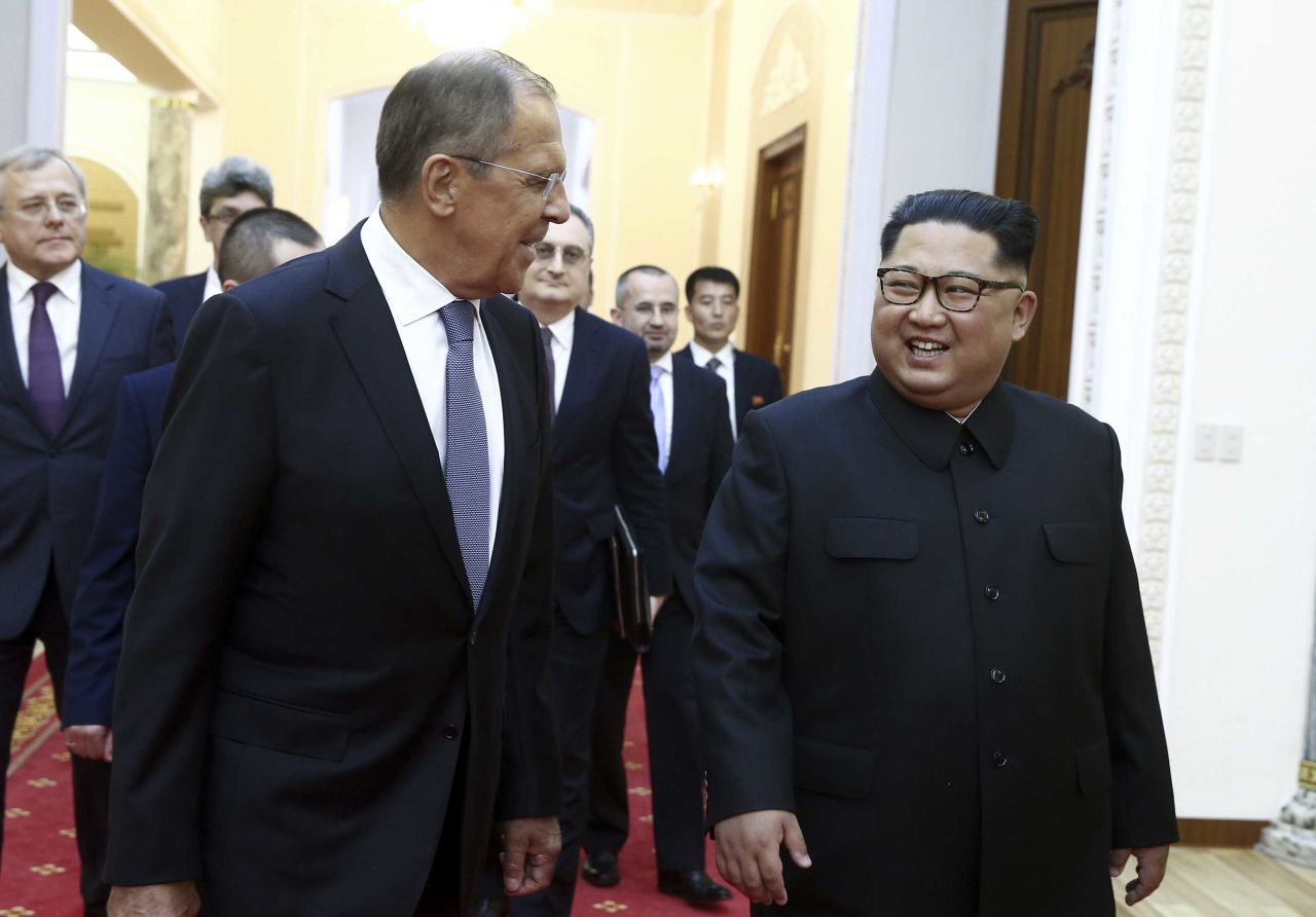 Lavrov and Kim walk and talk at the Palace.
