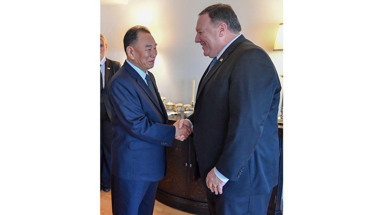 North Korean diplomat Kim Yong Chol shakes hands with US Secretary of State Mike Pompeo.  