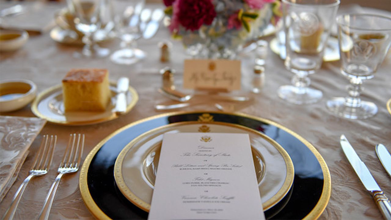 The official dinner menu featured traditional American staples such as beef and corn.