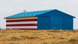 Barn painted in Red, White and Blue American Flag colors on Friday, May 4, 2018 outside of Fresno, Calif. (Ric Tapia via AP)