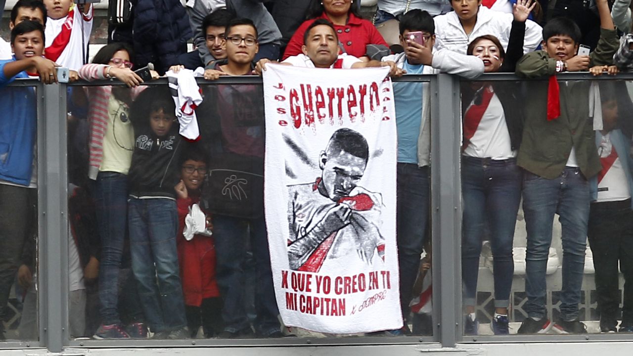 Fans of Peru display a banner in support of Paolo Guerrero.