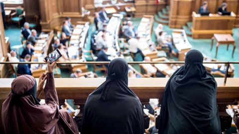 Women wearing niqab sit in the audience at the Danish Parliament in Copenhagen on Thursday.