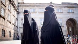 Women wearing niqab are pictured in front of the Danish Parliament in Copenhagen, Denmark, on May 31, 2018. - The Danish parliament on Thursday, May 31,2018, passed a law banning the Islamic full-face veil in public spaces, becoming the latest European country to do so. (Photo by Mads Claus Rasmussen / Ritzau Scanpix / AFP) / Denmark OUT        (Photo credit should read MADS CLAUS RASMUSSEN/AFP/Getty Images)