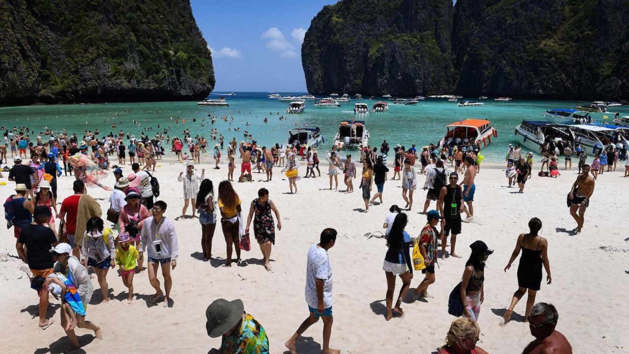 Crowds of tourists on Thailand's Maya Bay beach on April 9, 2018. Southeast Asia's once-pristine beaches are reeling from decades of unchecked tourism.