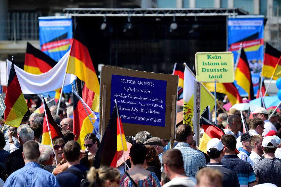 At an AfD rally on May 27,  supporters hold placards reading "No Islam in Germany."