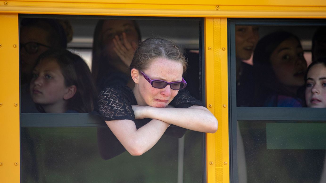 Middle-school students in Noblesville, Indiana, wait on a bus after their school was evacuated following a shooting on Friday, May 25. A teacher and a student were injured in the shooting. The teacher, 29-year-old Jason Seaman, <a href="https://www.cnn.com/2018/05/28/us/indiana-school-shooting-hero-teacher-speaks/index.html" target="_blank">tackled the unnamed suspect</a> to stop the gunfire.