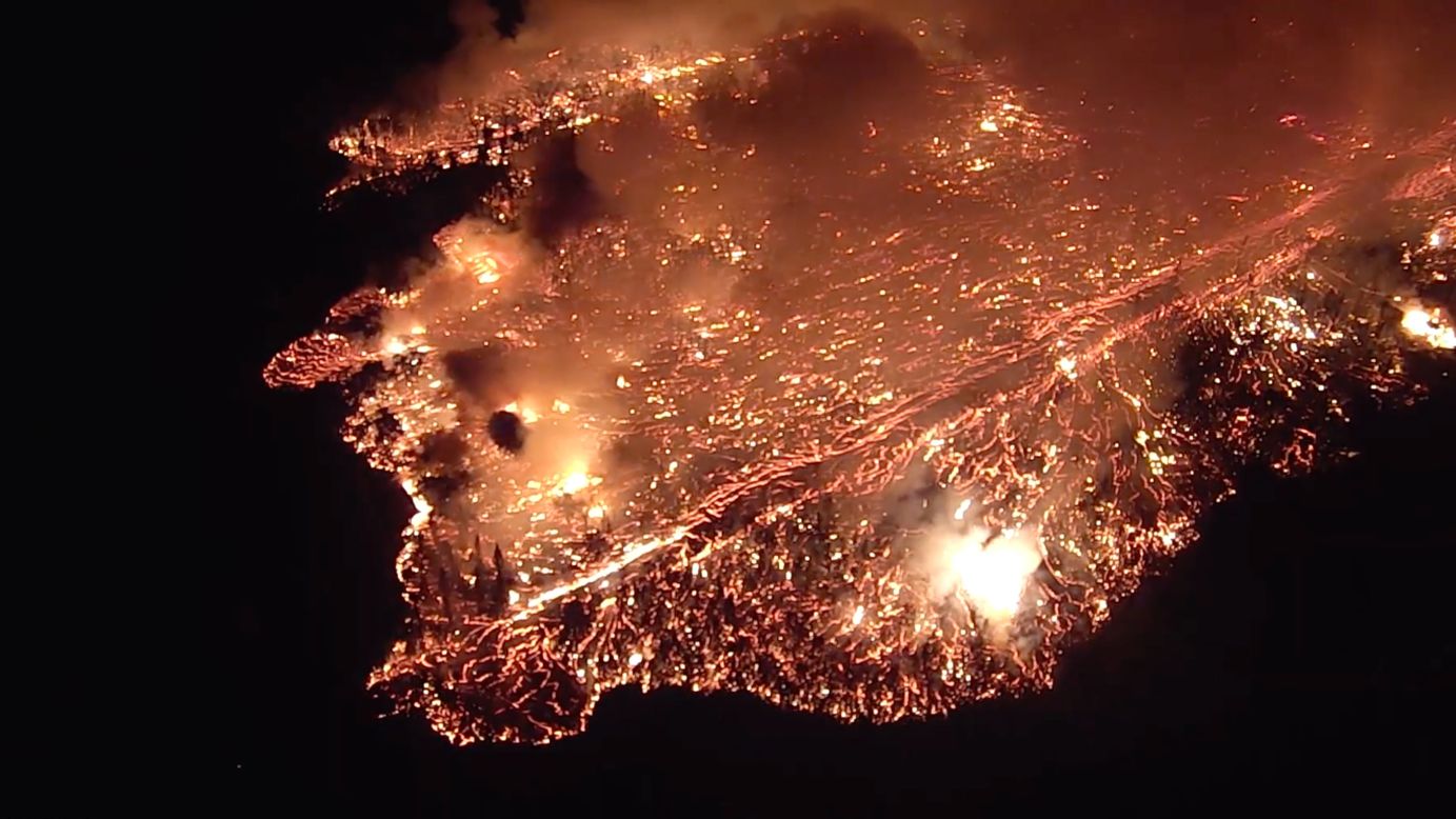 This aerial image shows an outbreak of fast-moving lava heading toward Leilani Estates, Hawaii, on Sunday, May 27. It's been four weeks since the Kilauea volcano erupted, but <a href="https://www.cnn.com/2018/05/31/us/hawaii-volcano-eruption/index.html" target="_blank">the lava is still as relentless as ever.</a> At least 75 structures have been destroyed, according to Hawaii Civil Defense spokesman Talmadge Magno. <a href="https://www.cnn.com/interactive/2018/05/us/hawaii-kilauea-volcano-eruption-cnnphotos/" target="_blank">See more photos from the volcano</a>