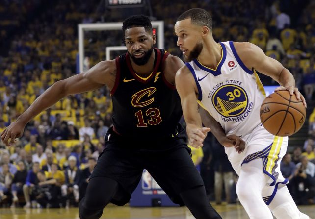 Curry drives past Tristan Thompson during the first quarter.