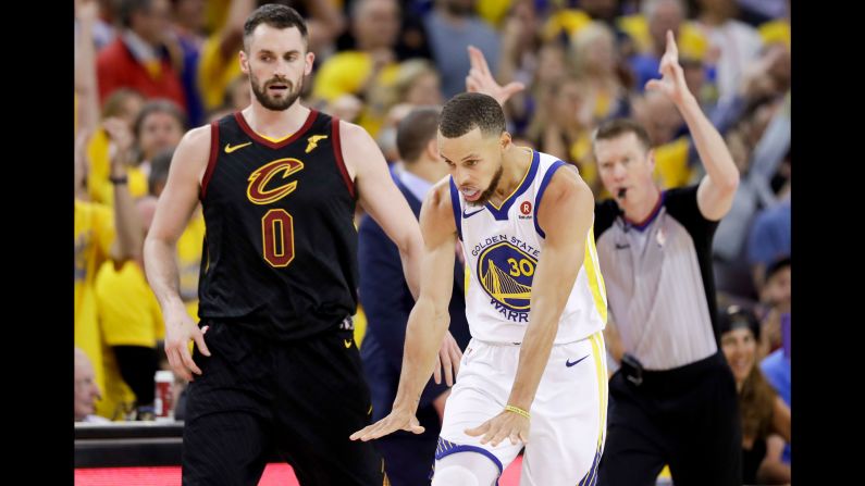 Curry celebrates a 3-pointer during Game 1 on Thursday, May 31. Curry had a team-high 29 points as the Warriors won in overtime 124-114.