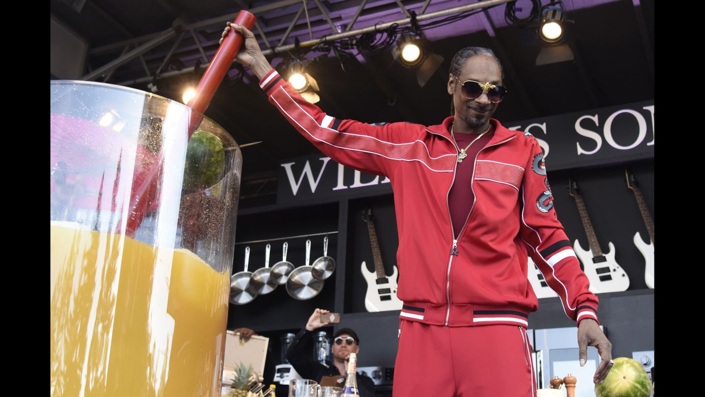 Rapper Snoop Dogg holds the straw of the world's largest cocktail -- a gin and juice made at the BottleRock Napa Valley music festival on Saturday, May 26. The drink, which is also the name of one of Snoop's most famous songs, was more than 132 gallons.