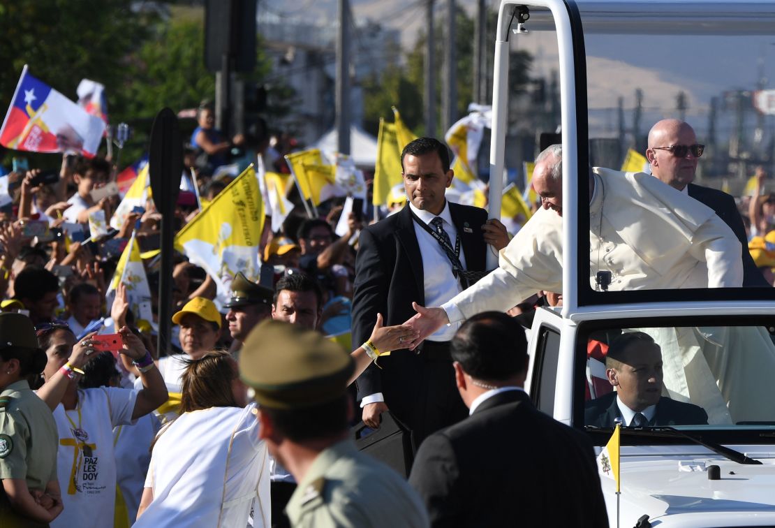 Pope Francis waves from the popemobile in Santiago, Chile on January 16, 2018.