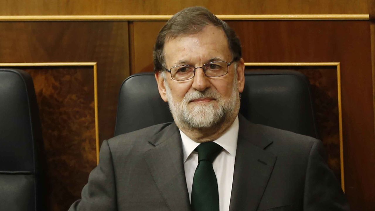 Spain's Prime Minister Mariano Rajoy is applauded by members of his party during the second day of a motion of no confidence session at the Spanish parliament in Madrid, Friday, June 1, 2018. Socialist opposition leader Pedro Sanchez is on the brink of ending Mariano Rajoy's more than six-year reign as Spanish prime minister in what would be the first ouster of a serving leader by parliament in four decades of democracy as Spain's conservative government appears doomed to lose a no-confidence vote in parliament(AP Photo/Francisco Seco)