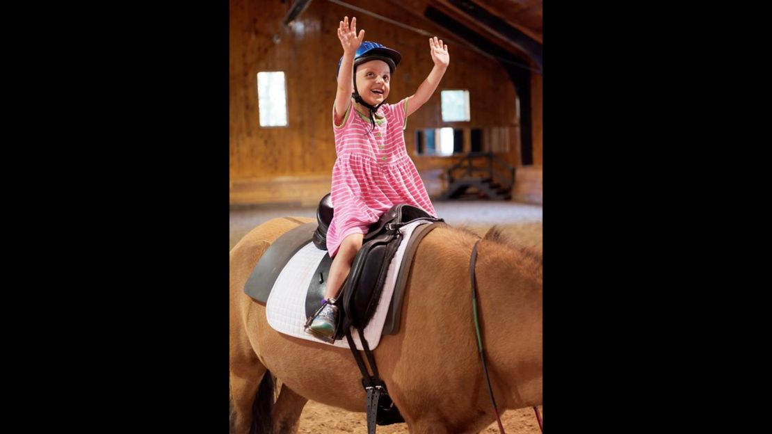 Seven-year-old Belle Swersey on her first day of riding lessons at Friends for Tomorrow in Lincoln, Massachusetts. 