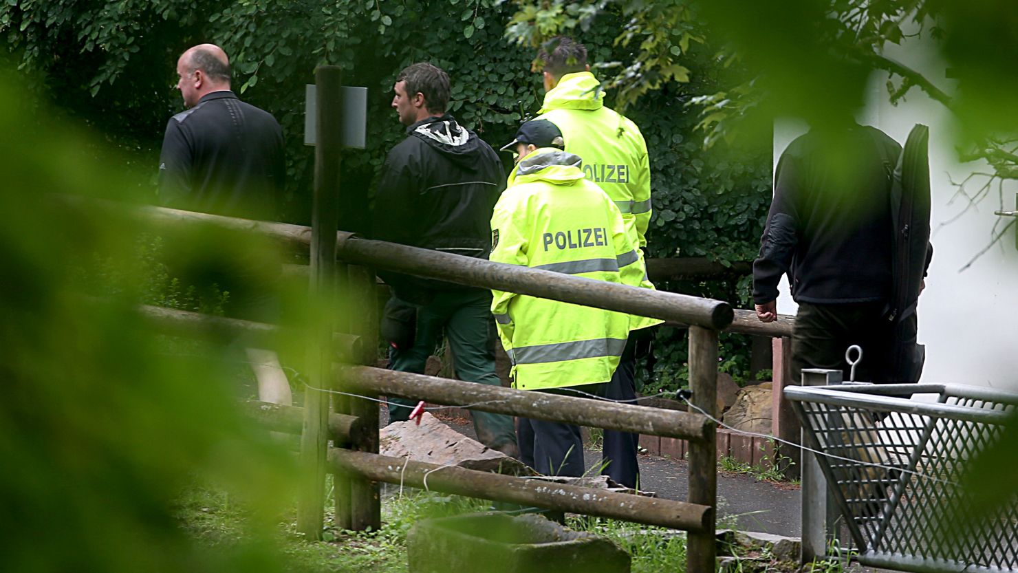 Zoo employees and police at the zoo on Friday.  