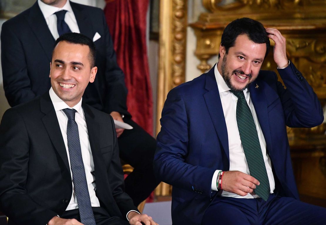 Luigi Di Maio (L) and Matteo Salvini (R) smile as they wait for the swearing in ceremony at the Quirinal.