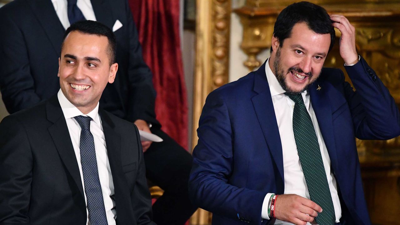 Luigi Di Maio (L) and Matteo Salvini (R) smile as they wait for the swearing in ceremony at the Quirinal.
