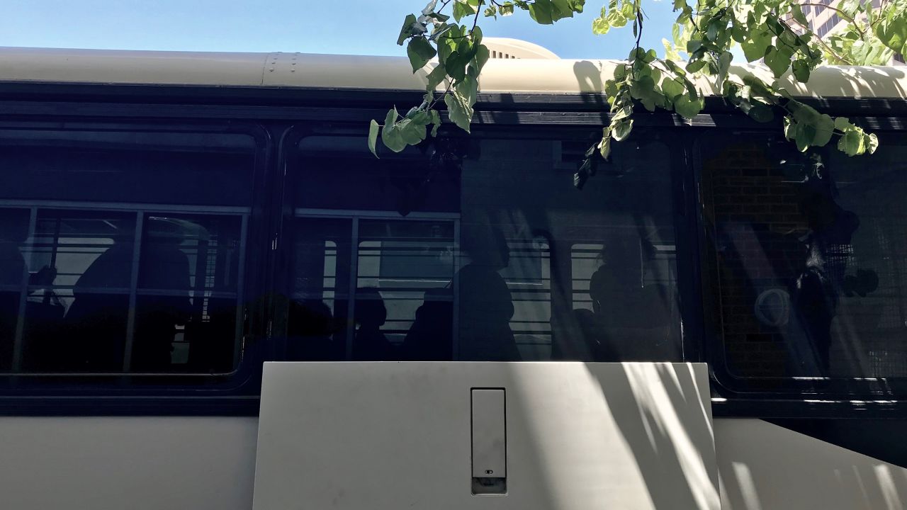 Undocumented women and their children take a last few steps in ICE custody as they leave a bus in San Antonio, Texas. The buses bring them from detention centers.
Source: CNN/Angela Barajas