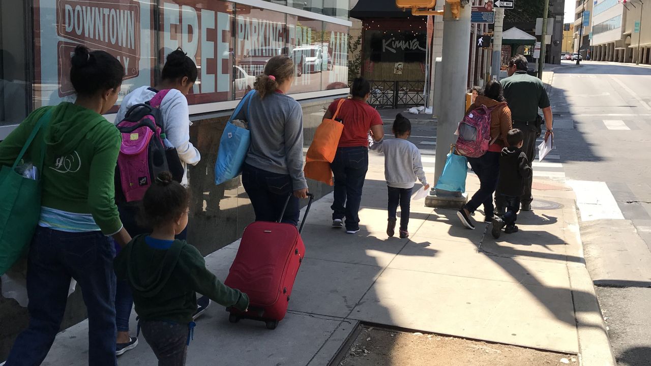 Undocumented women and their children are released from ICE custody to walk to a bus station in San Antonio, Texas, to continue their journey.  Source: CNN/Angela Barajas