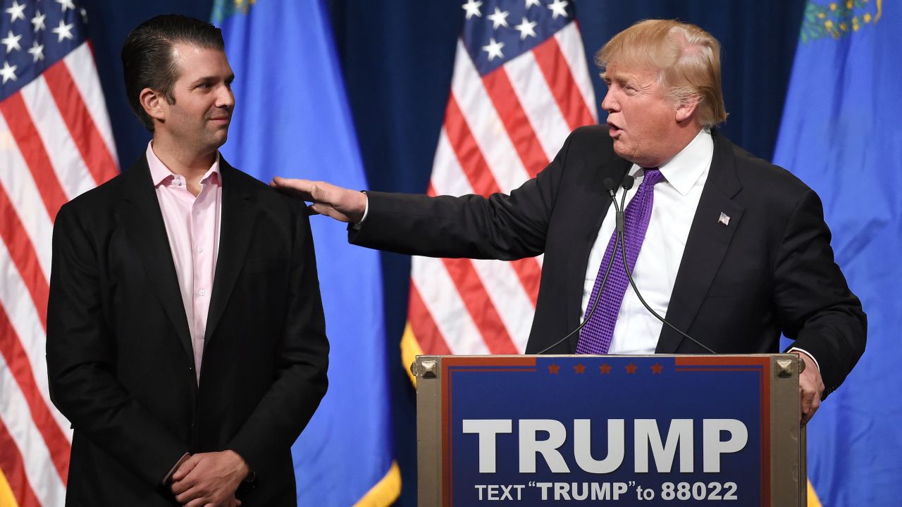 LAS VEGAS, NV - FEBRUARY 23: Donald Trump Jr. (L) looks on as his father, Republican presidential candidate Donald Trump, speaks at a caucus night watch party at the Treasure Island Hotel & Casino on February 23, 2016 in Las Vegas, Nevada. The New York businessman won his third state victory in a row in the "first in the West" caucuses. (Photo by Ethan Miller/Getty Images)