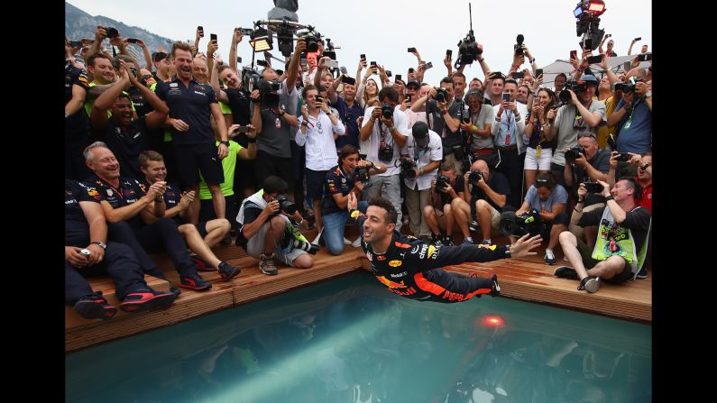 Race winner Daniel Ricciardo of Australia and Red Bull Racing celebrates with a swan dive into the swimming pool of the Red Bull Energy Station after the Monaco Formula One Grand Prix on Sunday, May 27, in Monte Carlo. 